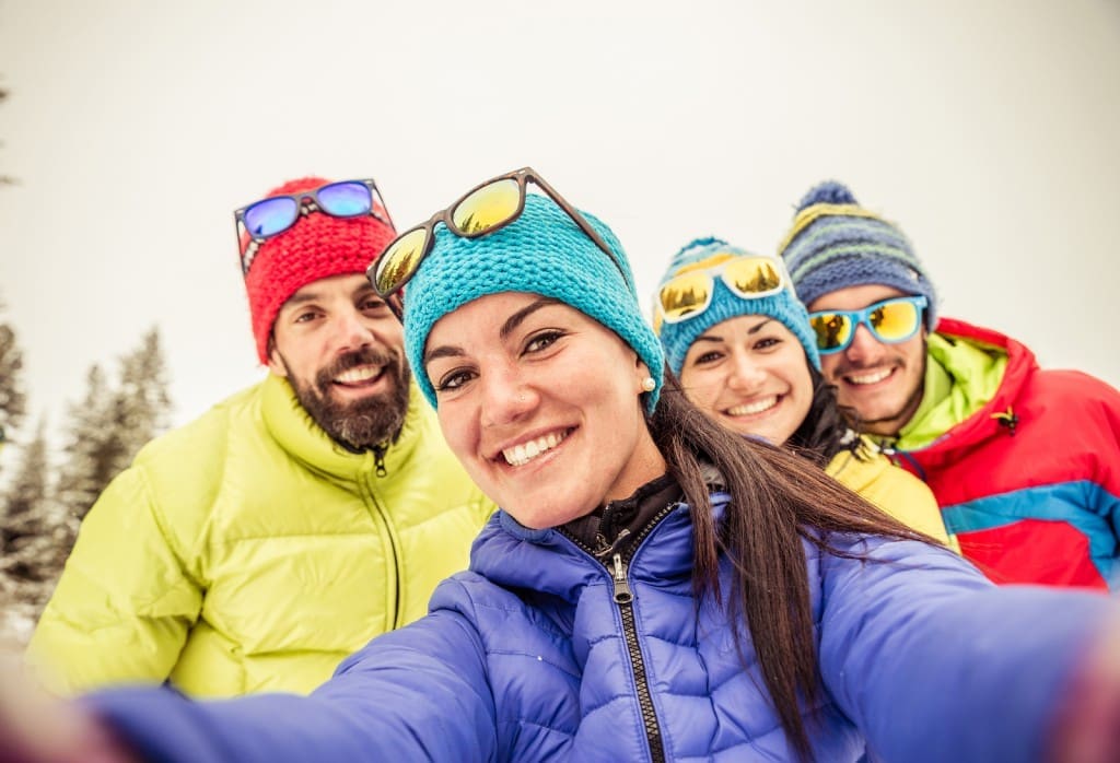 A group of young adults on a budget-friendly ski trip