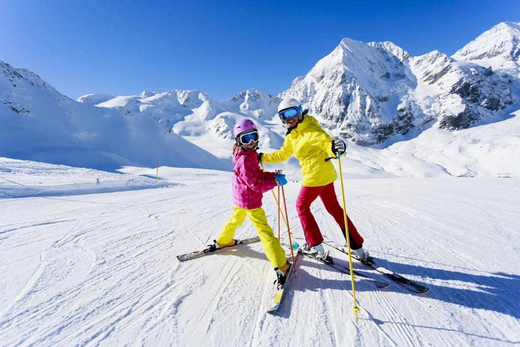 Skiing, winter, ski lesson - skiers on ski run