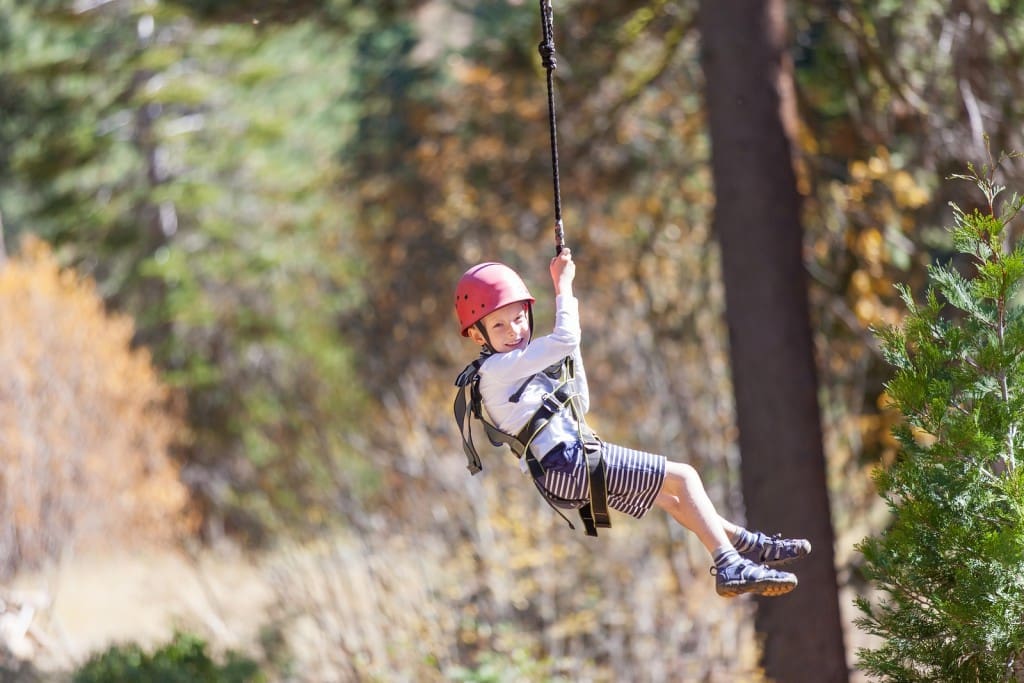 Child ziplining in the Alps