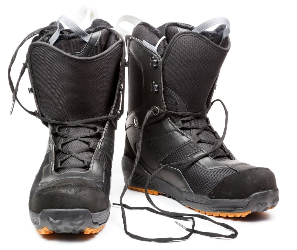 Snowboard boots on white background