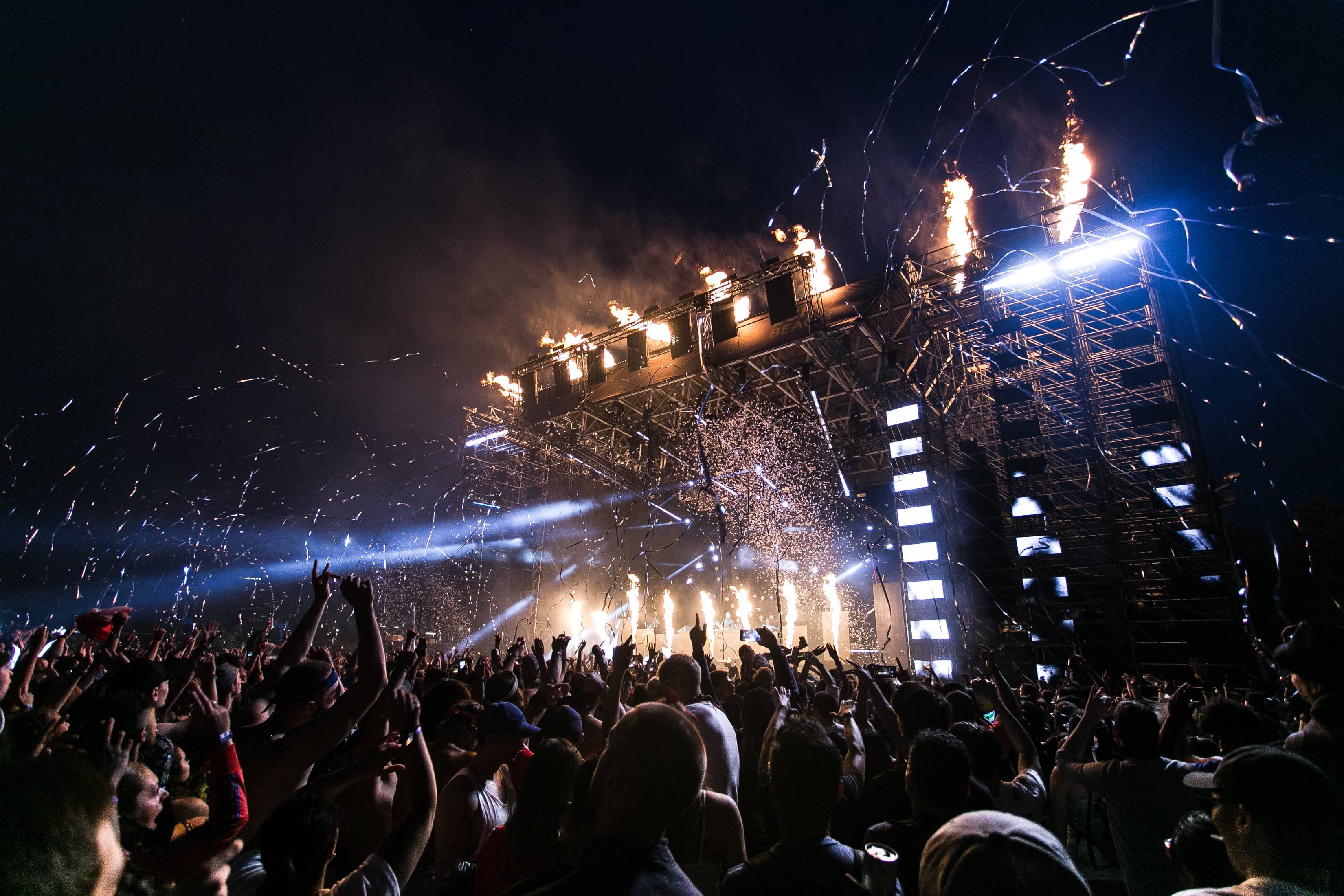 Large audience in front of stage at festival