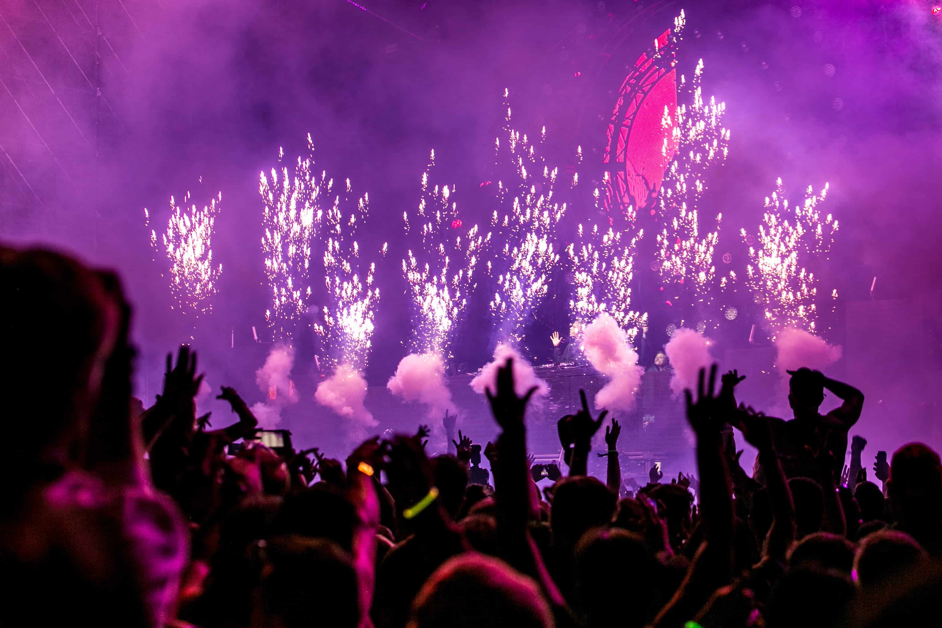 Crowd celebrating with lights for NYE in the Alps