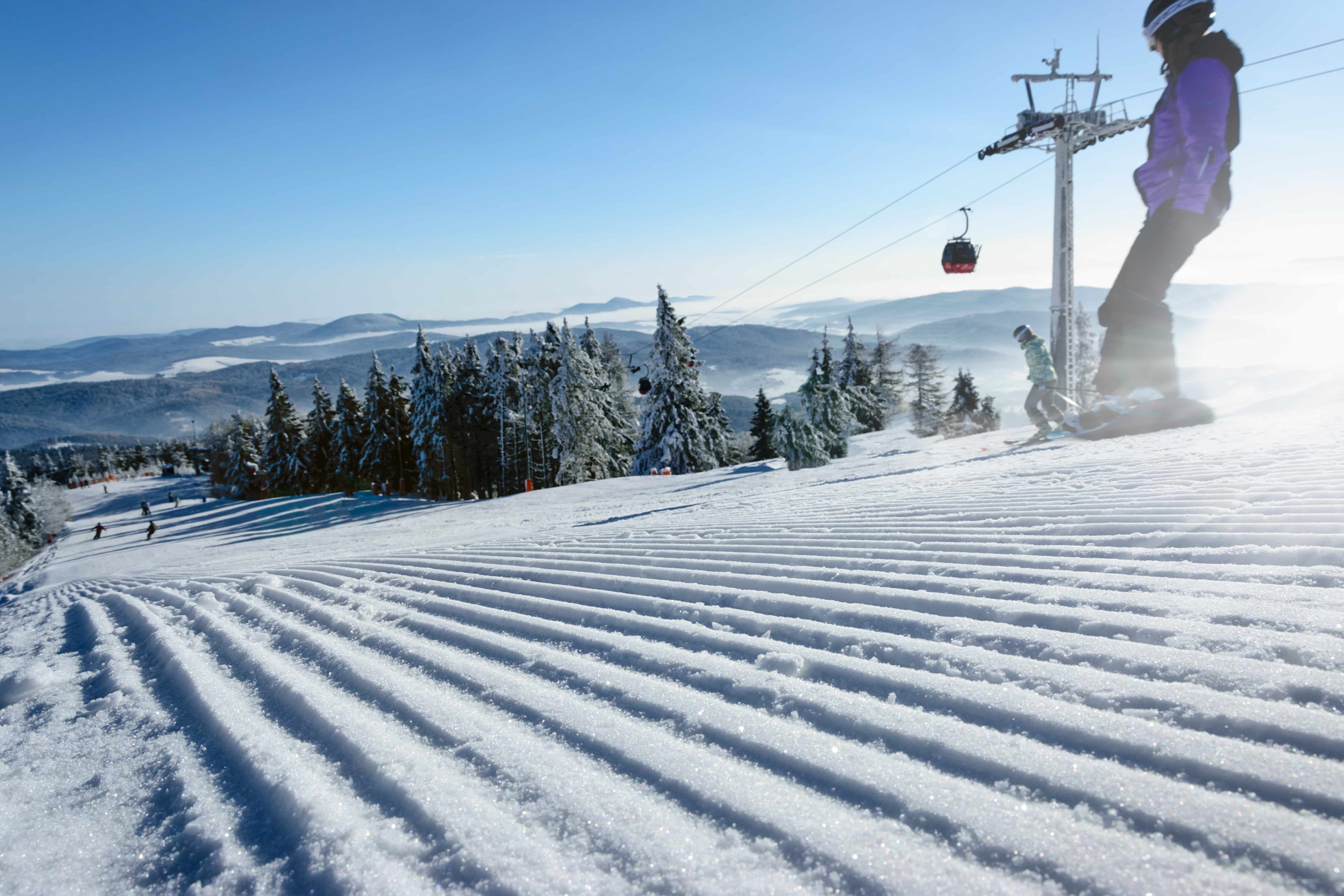 Snowboarding down a mountain at an Alpine ski resort