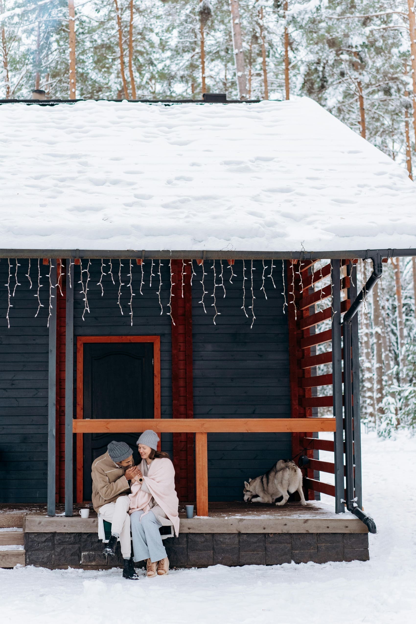 couple outside a ski chalet