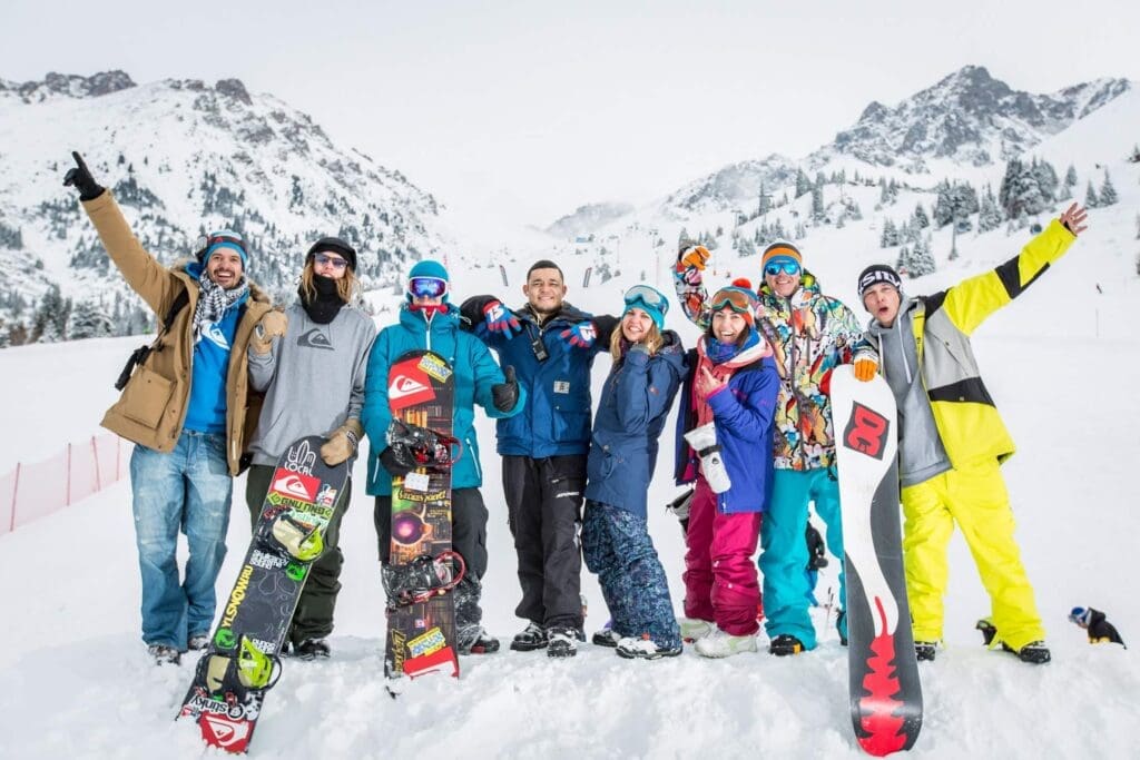 Group of young adults snowboarding 