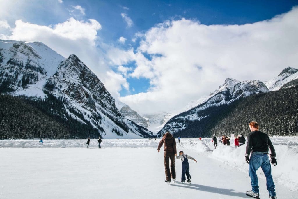 Family ice skating in the Alps