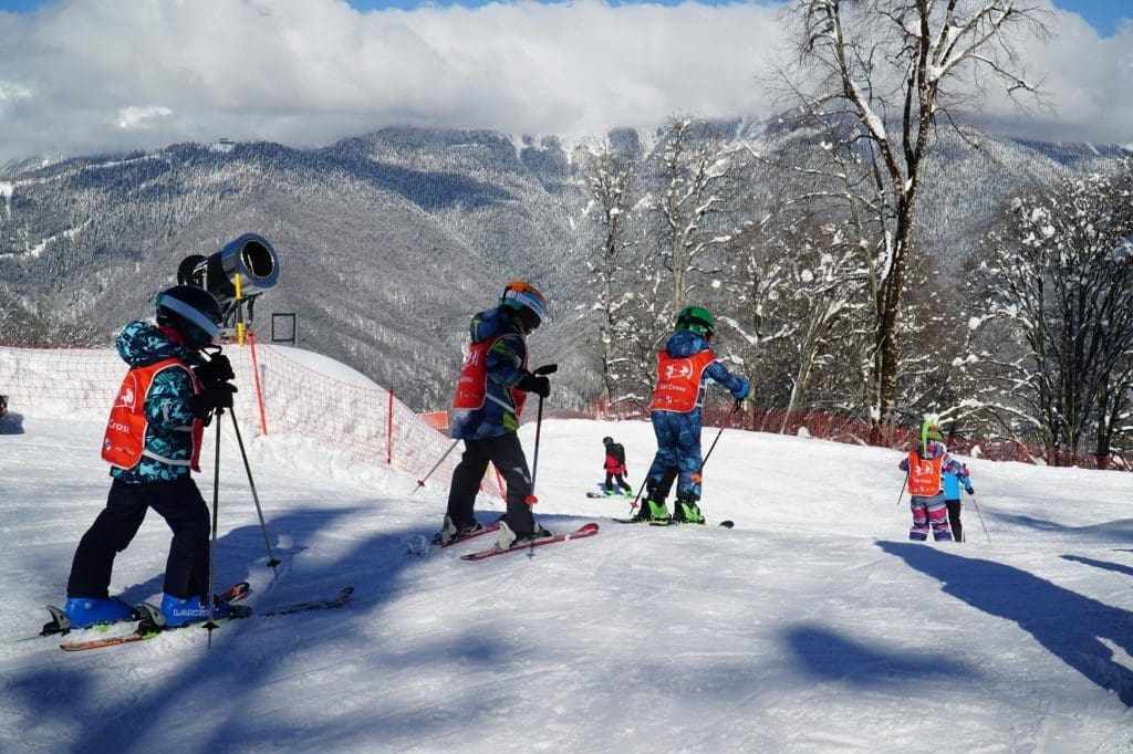 Kids learning to ski in the Alps